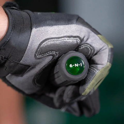 6 In 1 Do It All Tool Screwdriver With Flat Tip Phillips Hex Square Recess And Slotted Bits held by gloved hand