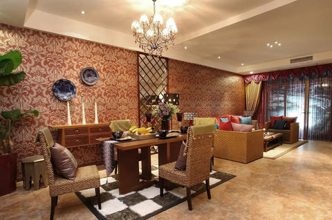 Luxurious dining room with elegant chandelier, wicker chairs, ornate wallpaper, and a stylish table setting