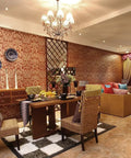 Luxurious dining and living room with elegant decor, chandelier lighting, and warm ambiance.