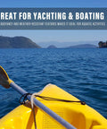 Yellow kayak on blue water with rope, highlighting buoyancy features for yachting and boating activities