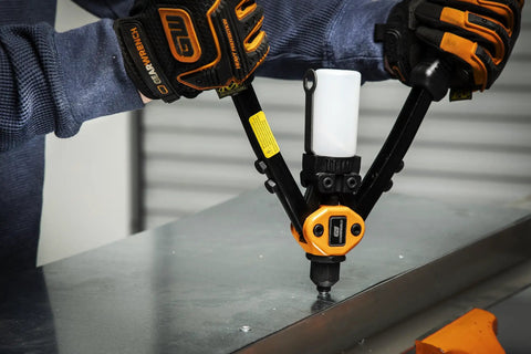 Person using 13 Inch Beefy Heavy Duty Hand Riveter with Double Compound Hinge on metal sheet