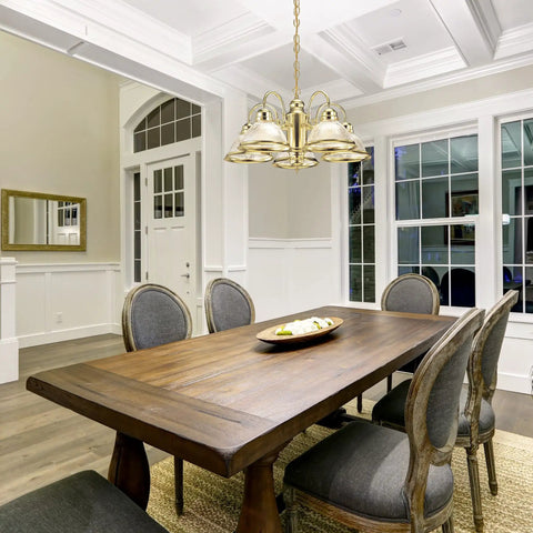 Millbridge Traditional 5-Light Indoor Dimmable Chandelier With Clear Ribbed Glass Shades For Entryway Foyer And Dining Room In Polished Brass illuminating a dining area