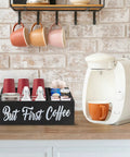 Boss Farmhouse Style Coffee Station Organizer For Countertop With Four Compartments beside a coffee machine on countertop