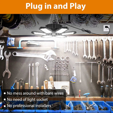 Two Pack 160W 16000LM Daylight LED Garage Light with plug shown above a workshop bench with tools.