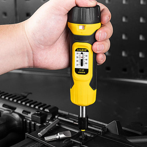 Close-up of 60Pcs Torque Screwdriver Wrench Set With One Quarter Inch Drive, 10-70 In-Lb Adjustable Torque in use on equipment.