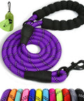 Built Tough Rope Dog Leash 6 Ft With Padded Handle Reflective Threads Anti Tangle Clip For Walking Medium And Large Dogs 1/2 Inch Thick Purple For Everyday Use visible, coiled purple rope with padded black handle and anti-tangle clip.