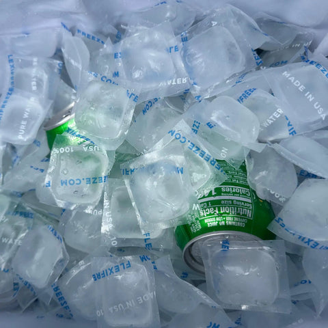 8 Pound Bag Of Reusable Ice Cubes For Coolers And Beverages Stay Chill With Refreezable Ice Cubes For Food Storage And Quick Freeze Long Lasting Cold To Beat The Heat shown filling a cooler with canned beverage