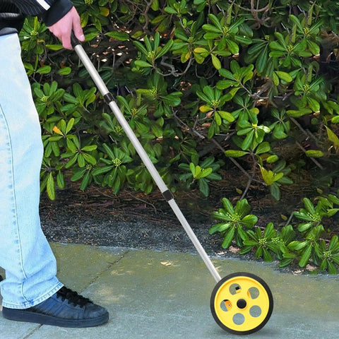 Measuring Wheel, Extendable Accurate Portable Metric Rolling Distance Tool in use on pavement with adjustable rod.