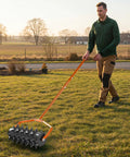 Man using Beast Heavy Duty 18 Inch Manual Lawn Aerator Roller With 49 Inch Adjustable Handle Spike Aerator on grass