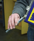 Grease Joint Rejuvenator Kit side view: handheld metal tool with knurled grip beside blue-yellow case