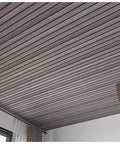 Top Shelf Peel And Stick Wood Panel Wallpaper For Ceiling with horizontal wood grain design in a modern living space.