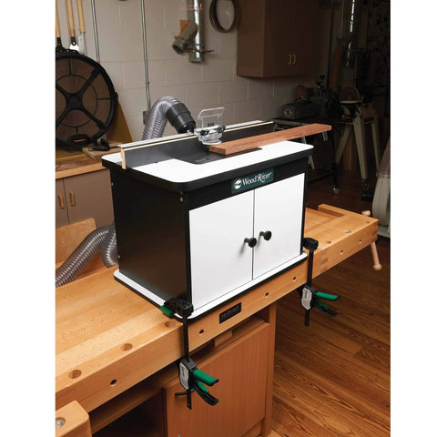 Heavy Hitter Benchtop Router Table Decked Out With A Beefy 24 Inch Laminate Top, Precision Tuned Aluminum Fence, Snap Switch Insert Plate in workshop.