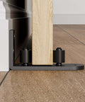 Adjustable Sliding Barn Door Floor Guide With Flat Bottom Design In Black 1 Piece Heavy Duty Steel Rail Nylon Roller installed