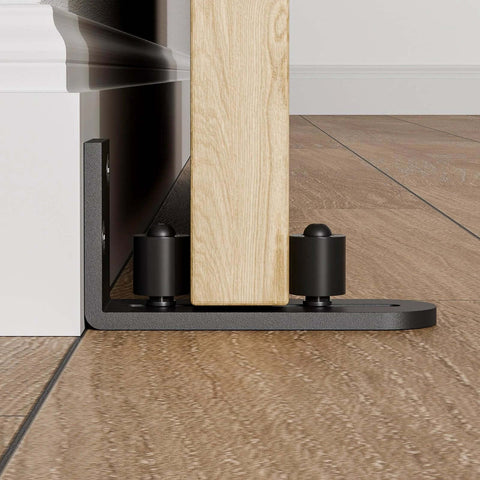 Adjustable Sliding Barn Door Floor Guide With Flat Bottom Design In Black 1 Piece Heavy Duty Steel Rail Nylon Roller installed