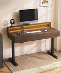 Height Adjustable Electric Standing Desk With Flip Top Hidden Storage And Handleless Drawers Featuring Motion Sensor LED Light For A Clean Workspace That Keeps Your Hustle Tight And Organized in a home office setting.