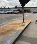 Heavy Duty Switchable Lifting Magnet With 12000 Pounds Breakaway Force Beast Mode Safety Lock lifting a steel plate in an outdoor mill job.