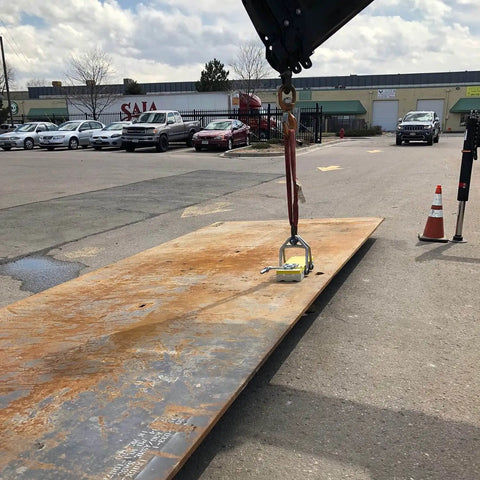 Heavy Duty Switchable Lifting Magnet With 12000 Pounds Breakaway Force Beast Mode Safety Lock lifting a steel plate in an outdoor mill job.