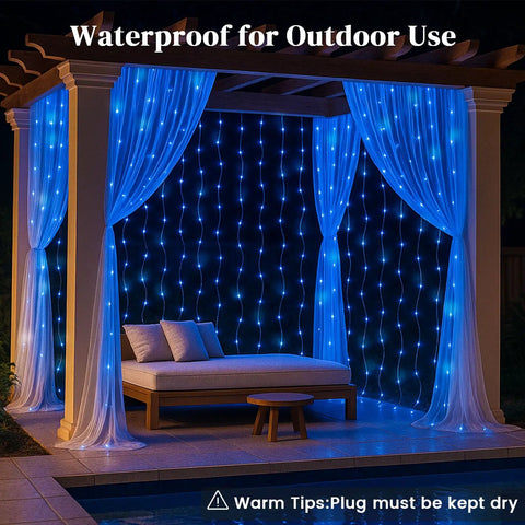 Outdoor setup with blue 300 LED Fairy Curtain Lights with waterproof waterfall glow, 9.8 feet by 9.8 feet, 10 vertical strands