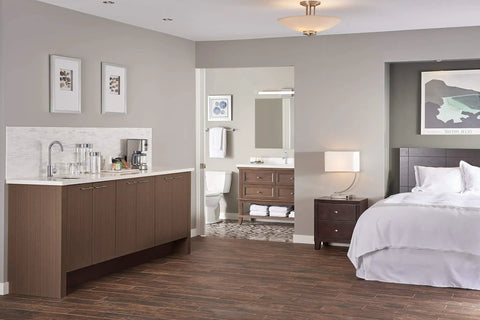 Modern bathroom with Parma Single Handle Lavatory Faucet With Metal Touch Down Drain, visible from bedroom view.