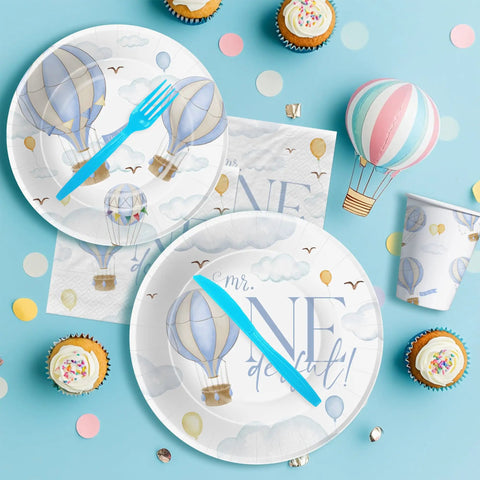 Hot Air Balloon 1st Birthday Party Supplies Set For Boys Mr Onederful Themed Tableware Pack Including Plates Napkins Cups And Cutlery In Blue For 24 Guests Lil Man Approved laid out on a blue surface with cupcakes and confetti.