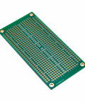 Double Sided ENIG Protoboard Solderable Breadboard For DIY Prototyping 2 By 4 Inch FR4 Board With One Tenth Inch Pitch Through Hole Grid Plated Through Hole Prototype Board Great For Arduino Projects angled view