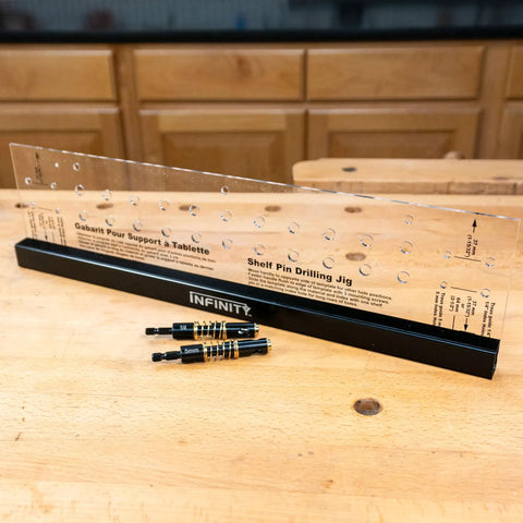 Beefy Shelf Pin Jig For Adjustable Shelves And Cabinets, 19-Inch Aluminum Spine displayed with drill bits on a workbench