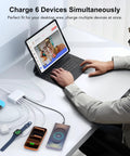 Person using GaN 100W USB C Charging Station Hub With 6 Ports Fast Charge Wall Block, charging multiple devices on desk