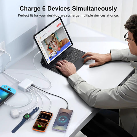 Person using GaN 100W USB C Charging Station Hub With 6 Ports Fast Charge Wall Block, charging multiple devices on desk