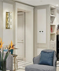 Lit Crystal Glass Wall Sconce In Gold Finish, Mid Century Modern Lighting in elegant living room decor with artwork.