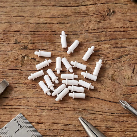 Forty Premium Quality PP Plastic Shutter Pins from Rock Solid Plantation Shutter Repair Kit on wooden surface.