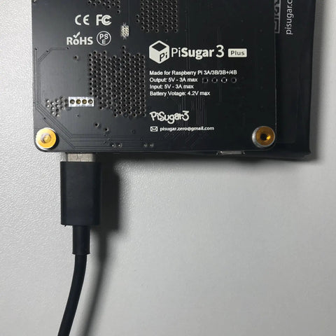 Close-up of Portable Pwnagotchi Power Management For Raspberry Pi 3B 3B Plus And 4B with USB connection, black circuit board