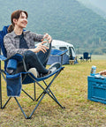 Person sitting on Two Pack Oversized Folding Camping Chair Set With High Back Padded Comfort Grab And Go Style Lightweight Steel Frame