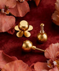 4-Pack Solid Brass Gold Cabinet Knobs With Flower Backplate, on red velvet with flower decor, showing screws and tarnish-resistant finish.