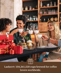 Group enjoying coffee together with pastries, surrounded by gifts, celebrating with the Straight Up Solid Espresso Machine for home.