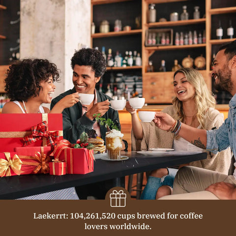 Group enjoying coffee together with pastries, surrounded by gifts, celebrating with the Straight Up Solid Espresso Machine for home.