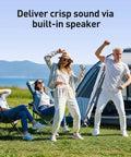 People dancing outdoors holding Hella Massive 96GB MP3 Player With Bluetooth And WiFi, 4 Inch Android MP4 Player T08 near tent