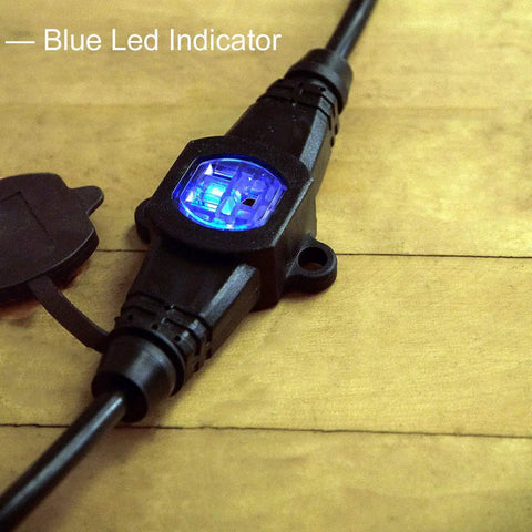 Close-up of a blue LED indicator on a 25 Foot 14 Gauge Outdoor Power Extension Cord With Four Outlets And Evenly Spaced Plugs, ideal for use.