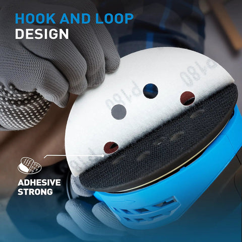 Close-up of a hand attaching a sanding disc to a sander highlighting hook and loop design of 72 Piece 5 Inch 8 Hole Hook And Loop Sanding Discs Set