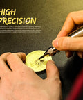 Hands using the Precision Pneumatic Engraving Pen And Air Scribe Tool For Metal Ceramic Glass Etching With Adjustable Speed on a metal surface.