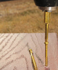 Drill inserting Pro Grade Three And One Eighth Inch RT Composite Exterior Trim Screws Size Eight into wood