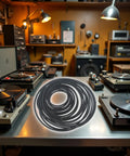 Old School Cassette Deck Belts Pack 20 Pcs 1.5mm round rubber belts displayed on a table surrounded by vintage audio gear.