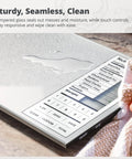 Meal-Prep Go-To Food Scale With Built-In Nutrition Calculator No App Needed 2000 Preloaded Food Codes Compact Battery-Operated Kitchen Scale 11 Lb Capacity Ideal For Weight Loss And Healthy Cooking Silver showing close-up of seamless tempered glass surface with water droplets and visible control panel.