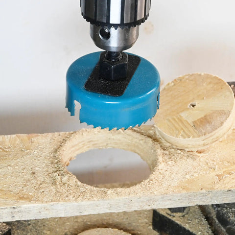 Open Slot Hole Saw Kit With Double Ground Teeth 21 Piece Drill Bit Set in action on plywood
