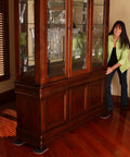 Woman using Heavy Duty Furniture Sliders For Hardwood Tile Luxury Vinyl And Other Hard Surfaces Glide Smoothly And Protect Floors Move Heavy Stuff Easy 8 Inch Long By 5 Inch Wide Four Slide Set Built To Last For Pros And Home Use under cabinet