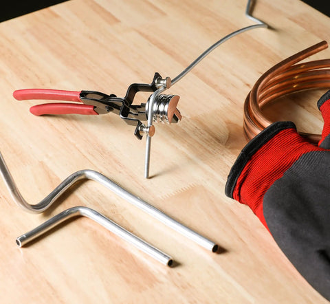Heavy Duty 180 Degree Tubing Bender For HVAC Plumbing And Auto Projects Fits 1/4, 5/16, And 3/8 Inch Tubing on a wood surface