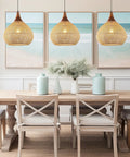Hand Woven Rattan Pendant Light With Sturdy Wood Frame, 15 Inch Boho Ceiling Fixture For Kitchen Island And Dining Room over a dining table.