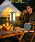 Outdoor scene with Rechargeable 3-In-1 Camping Lantern on table, showing 1/4 inch screw base next to man and tent.