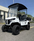 Two Seater Electric Golf Cart With 48V Lithium Battery And Heavy Duty Plastic Bed Powered By A Badass 4Kw Motor in white on road.