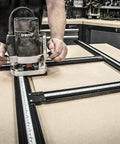 Adjustable Router Jig Frame and Guide System for Cutting Square and Rectangular Recesses, Slots, and Face Panel Molds With a Router, Large 23.6 By 23.6 Inches Working Area, Four 27.6 Inch Extrusion Rails With Dual Metric Imperial Scales Varijig, being used for precise woodworking.