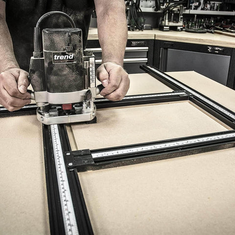 Adjustable Router Jig Frame and Guide System for Cutting Square and Rectangular Recesses, Slots, and Face Panel Molds With a Router, Large 23.6 By 23.6 Inches Working Area, Four 27.6 Inch Extrusion Rails With Dual Metric Imperial Scales Varijig, being used for precise woodworking.